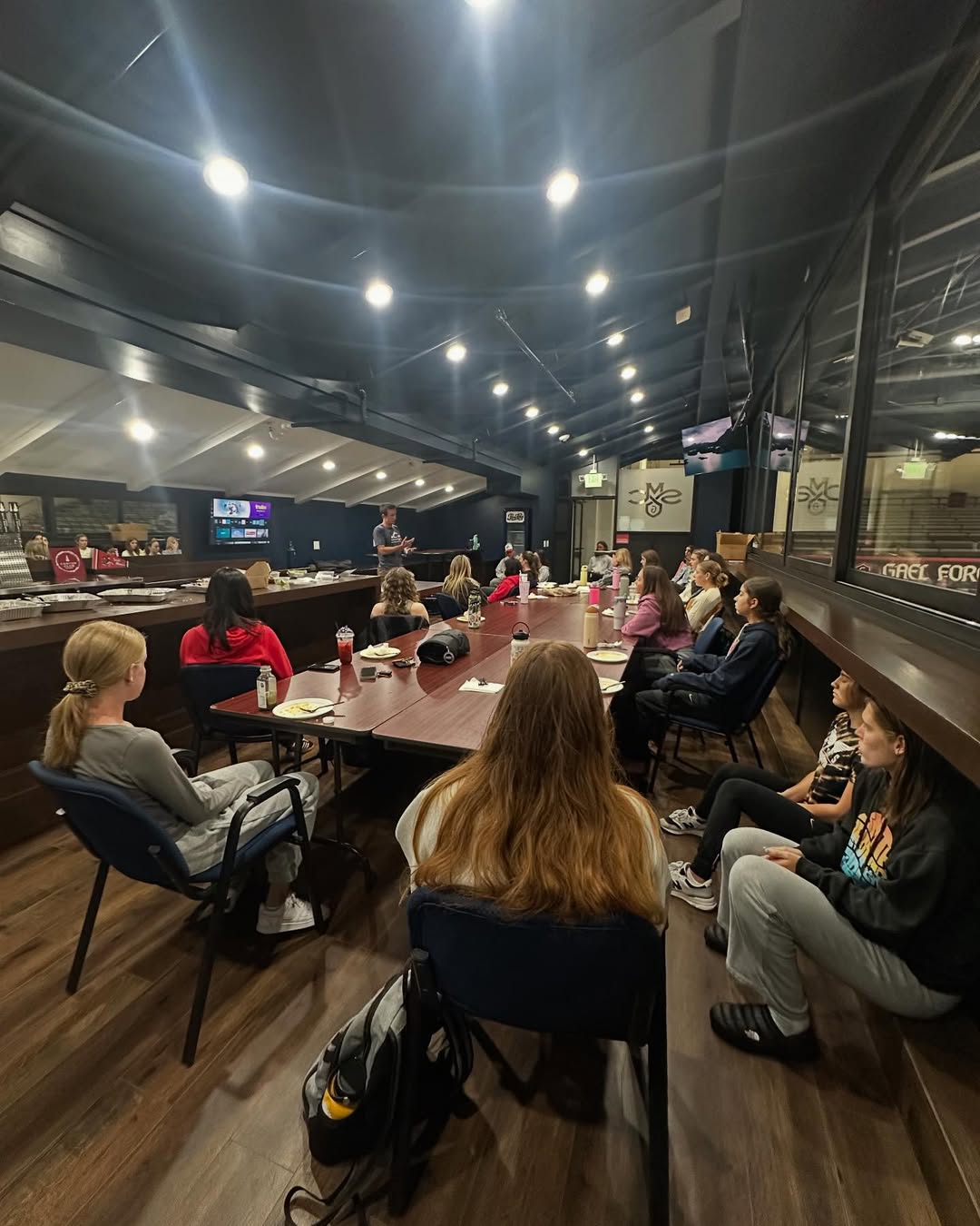 Dr. Tim Bayley leading a mental performance session with the Saint Mary's College women's cross country and track team